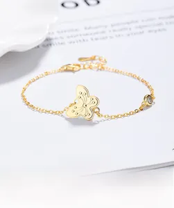 Macro detail of gold 925 sterling silver butterfly bracelet with clear zircon on magazine