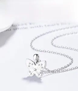 Macro shot of 925 sterling silver butterfly pendant with multi-layer plating details