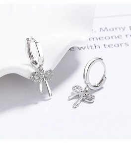 Detail of S925 sterling silver bow earrings with sparkling cubic zirconia inlay
