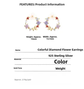 Macro detail of silver flower and butterfly earrings with colored cubic zirconia stones