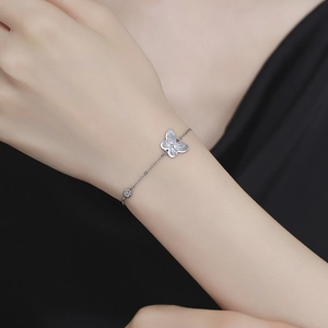 Elegant 925 sterling silver butterfly bracelet with cubic zirconia on a female wrist