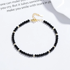 925 silver beaded bracelet with black onyx faceted stones and golden spacers