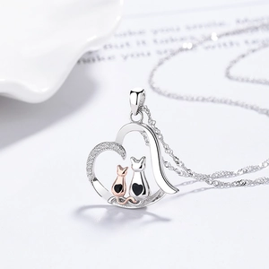 925 silver heart necklace featuring twin cats in silver and rose gold with white zircons