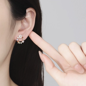925 silver wreath earrings with colorful zircons and shell flower worn on ear