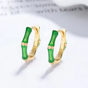 Detail view of S925 silver bamboo hoop earrings with green enamel and gold plating