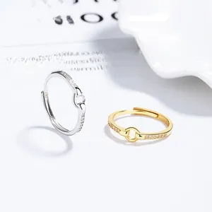 Detailed shot of S925 sterling silver rings with oval zircons in gold and silver finish