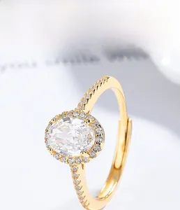 Detailed macro of golden S925 silver ring featuring a large oval cubic zirconia stone