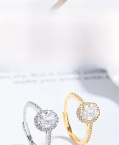 Macro shot of silver and gold plated S925 rings featuring oval cut pave cubic zirconia