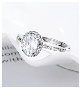 Macro shot of 925 silver halo ring with oval cubic zirconia and side stones details