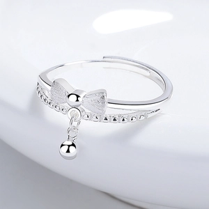 Adjustable 925 silver double-layer bow ring with matte finish and metal bead charm