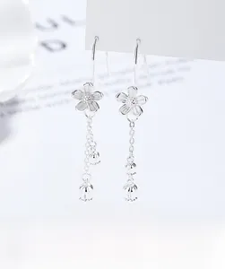 Detail of silver camellia tassel earrings with elegant 925 silver fringe drop design