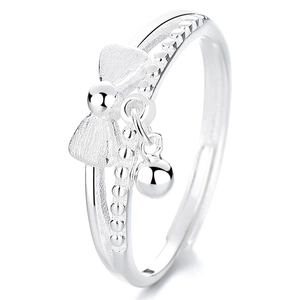 925 silver bow ring with double layer beaded band and dangling charm on white background