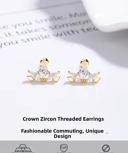 Detailed macro view of 925 sterling silver crown studs with sparkling cubic zirconia