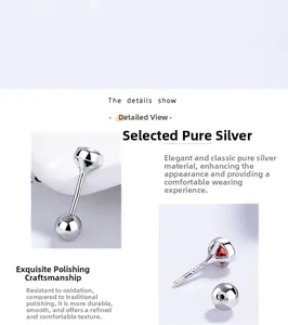 Close-up of 925 sterling silver ear stud with red gemstone and polished finish details