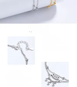 Close-up of 925 sterling silver lock pendant and double-layered beaded chain links
