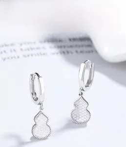 Detailed close-up of S925 sterling silver gourd earrings with textured honeycomb pattern