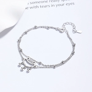 Elegant 925 silver double-layer beaded bracelet with traditional Ruyi lock pendant on white background