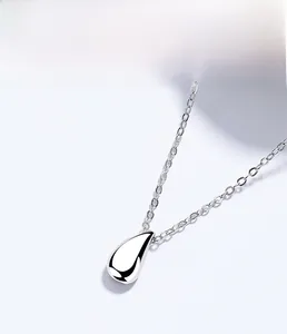 Macro shot of 925 sterling silver teardrop pendant with mirror polished finish and electroplating