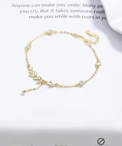 Detail of 925 sterling silver wheat bracelet featuring round cubic zirconia in gold