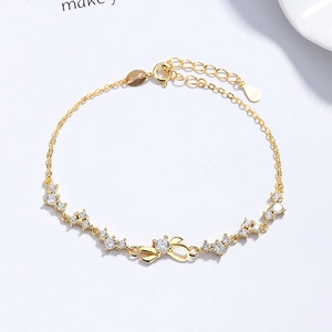 Eleganter Armband aus 925er Sterlingsilber mit Zirkonia-Schleife und Goldbeschichtung