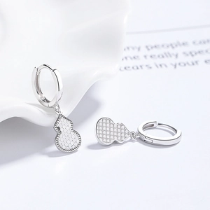 Elegant 925 sterling silver gourd drop earrings with textured pattern on ceramic tray
