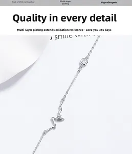 Close-up of S925 silver bracelet featuring heartbeat line and sparkling zircon stone