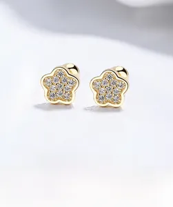 Macro shot of 925 sterling silver flower earrings with zircon pavé and screw back studs