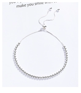 Close-up of a 925 sterling silver beaded bracelet with adjustable slider clasp
