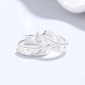 Minimalist 999 silver hollow cross hoop earrings with geometric diagonal patterns