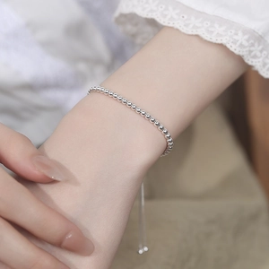 Elegant 925 sterling silver beaded bracelet with adjustable slide clasp on woman wrist