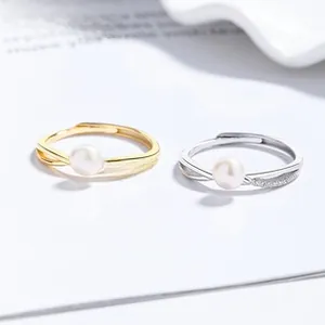 Detail of 925 silver sunflower pearl rings with zircon accents in gold and silver finish