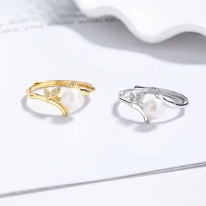 Detail of 925 silver bamboo rings with fresh water pearls and micro-inlaid zircons