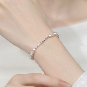 925 silver irregular nugget and pearl bracelet for women showing elegant wrist wear
