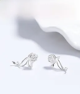 Macro detail of S925 sterling silver rose stud earrings with layered petal design