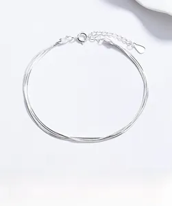 Detailed view of triple-layered 925 sterling silver snake chain bracelet with clasp