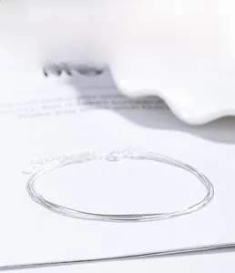 Detailed view of triple-layer S925 sterling silver snake bone bracelet with extender chain