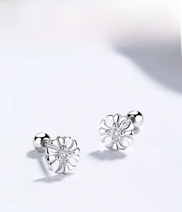 Detail of 925 sterling silver cross stud earring with zircon and screw back closure