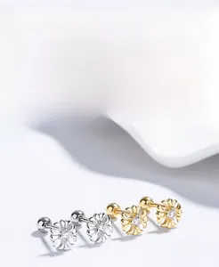 Macro shot of 925 sterling silver cross stud earrings with zircon and screw back