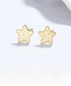 Macro shot of 925 silver star earrings featuring a crushed ice texture and screw backs