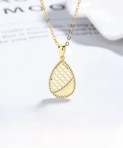 Macro shot of 925 sterling silver hollow teardrop pendant necklace with honeycomb pattern