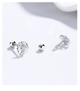 Macro view of floral 925 sterling silver studs with zircon and screw back closure