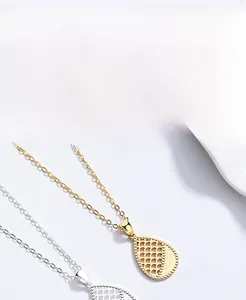 Detail showing 925 sterling silver hollow water drop pendant with fish scale texture