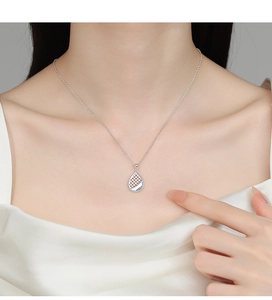 Detailed view of an S925 silver hollow teardrop pendant on a delicate chain necklace