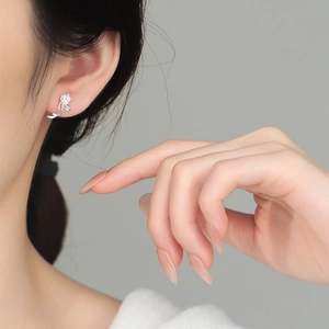 Elegant 925 sterling silver rose stud earrings for women shown on model profile