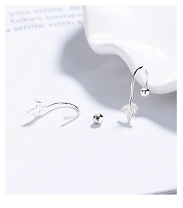 Macro shot of S925 sterling silver maple leaf earrings with fine vein texture details