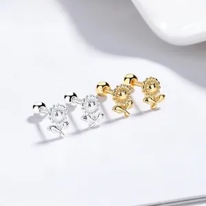 Macro detail of sunflower silver earrings with secure screw-back ball closures