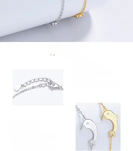 Macro detail of 925 sterling silver dolphin bracelet featuring love engraving and lobster clasp