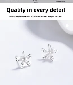 Close-up of S925 sterling silver five-petal flower earrings with zircon center