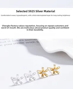 Detail of flower stud earrings in S925 silver with zircon stones and thick plating