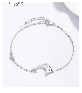 Detail of S925 sterling silver dolphin bracelet with YOU engraving and zircon stone